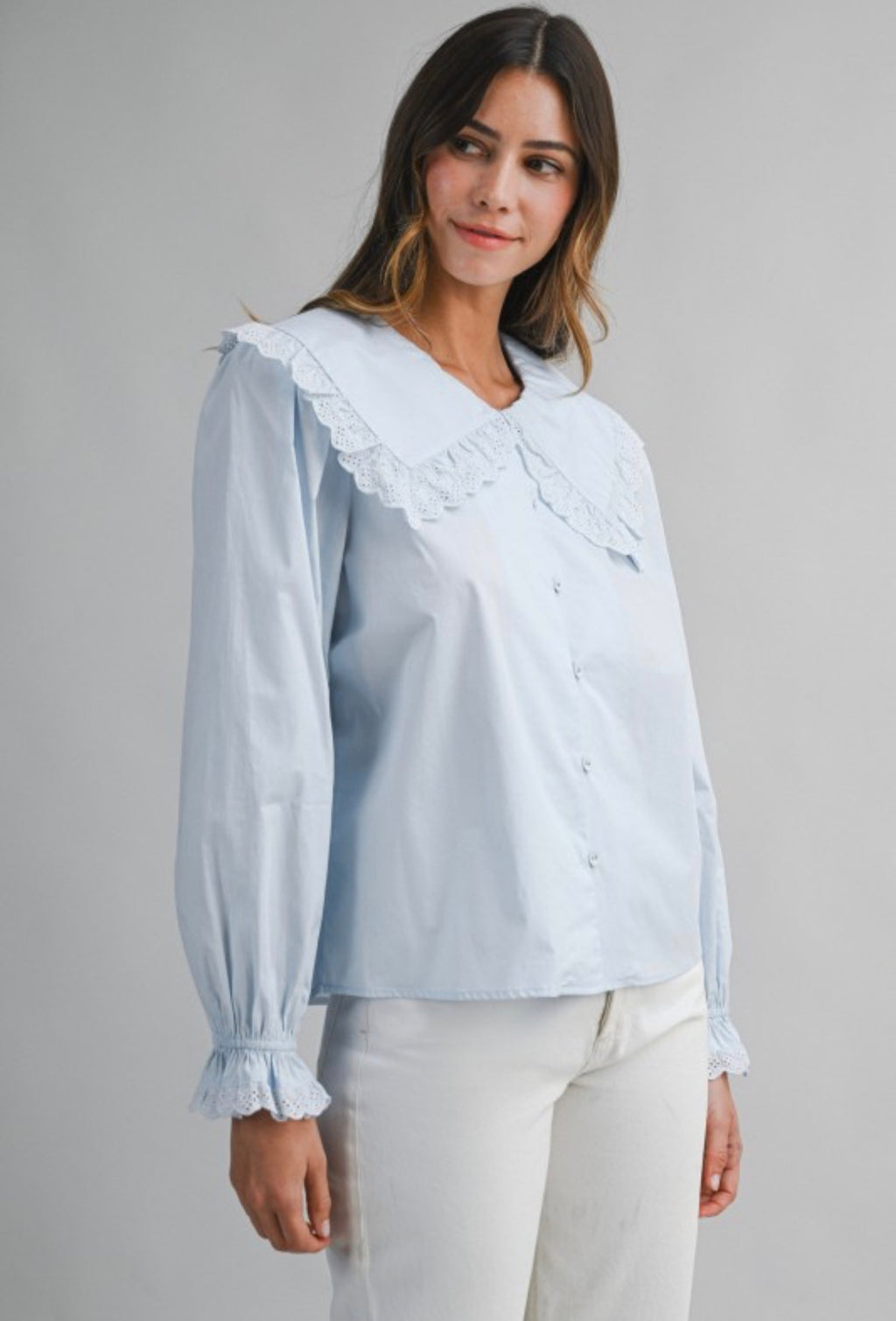 Blue light blouse with collar and long sleeves
