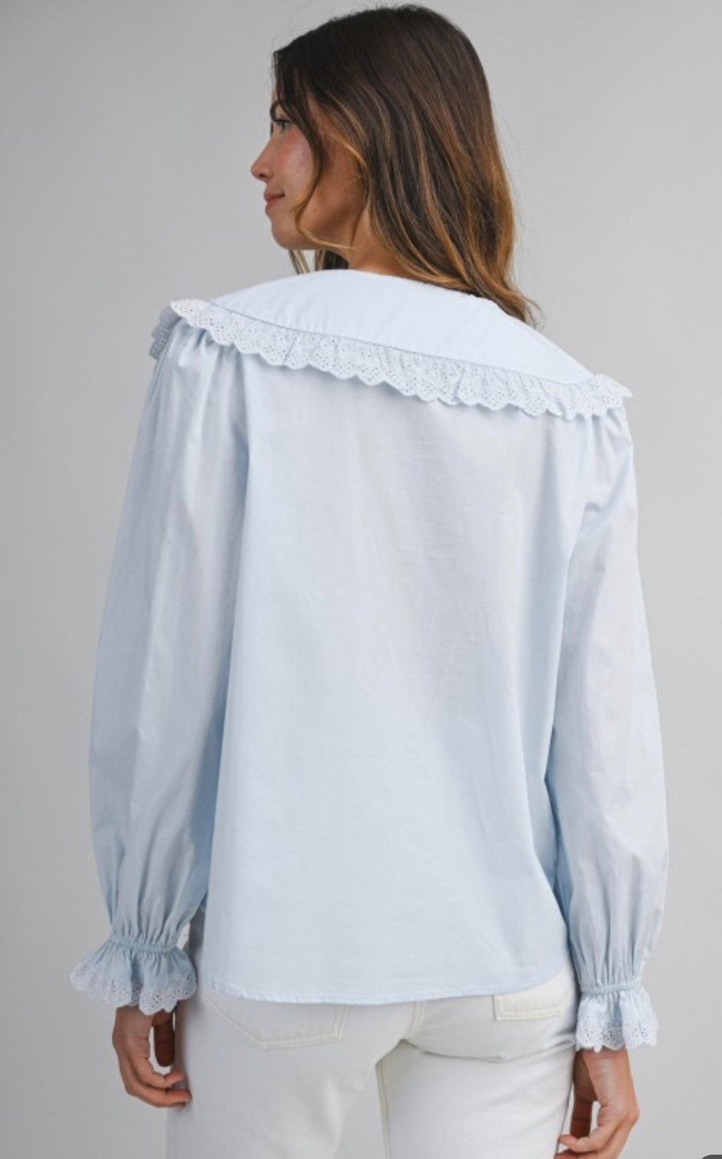 Blue light blouse with collar and long sleeves