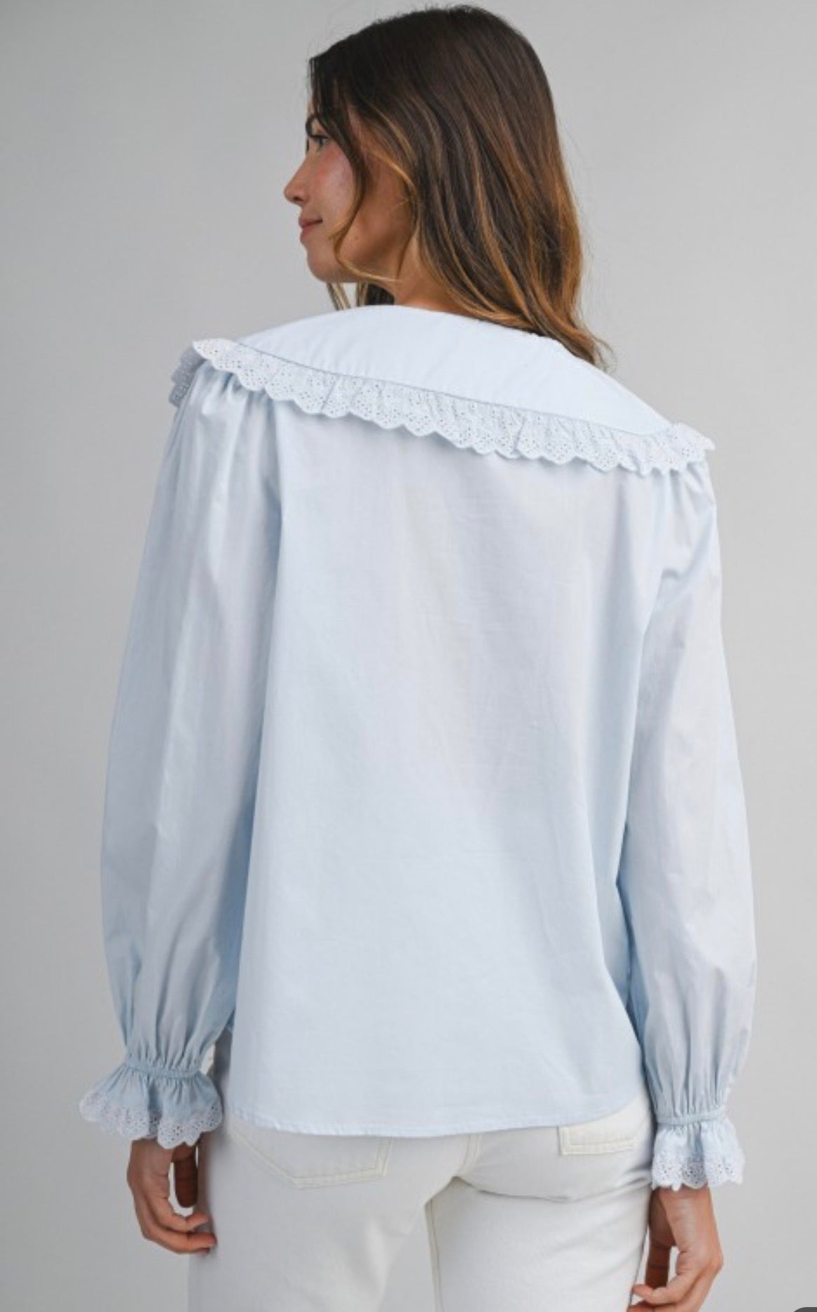 Blue light blouse with collar and long sleeves